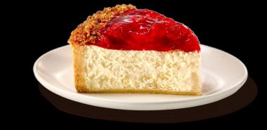 leckerer Käsekuchen mit Früchten - ein Stück 